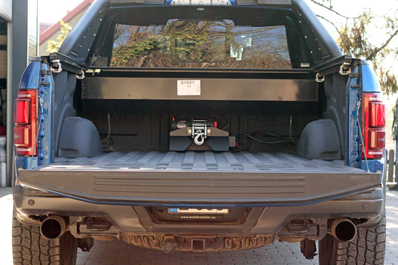 Short mounting plate for winch for pickup truck bed